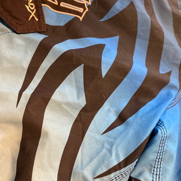 Billabong Blue and Black Board Shorts with Tribal Patterns - Picture 4 of 5